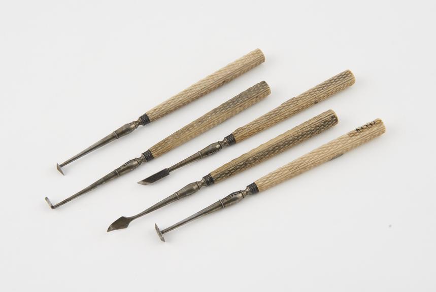 5 descaling instruments, steel with ivory handles