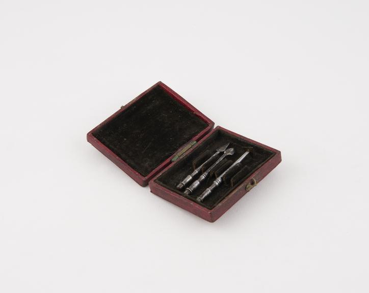 Personal dental descaler set in red leather covered case