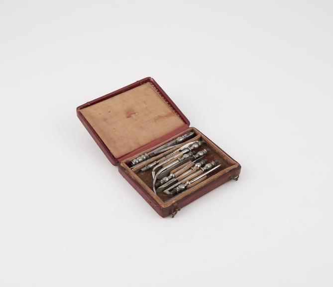 Personal dental descaler set, in red leather covered case