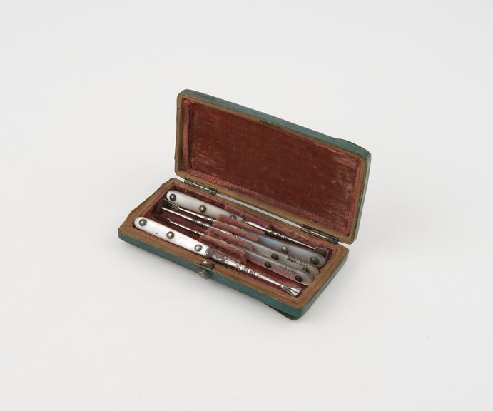 Personal dental descaler set, in green fishskin covered case