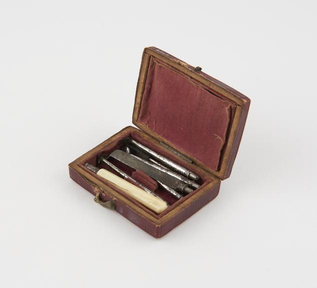 Personal dental descaler set, in tooled red leather case