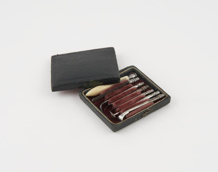 Personal dental set, in rectangular black tooled leather