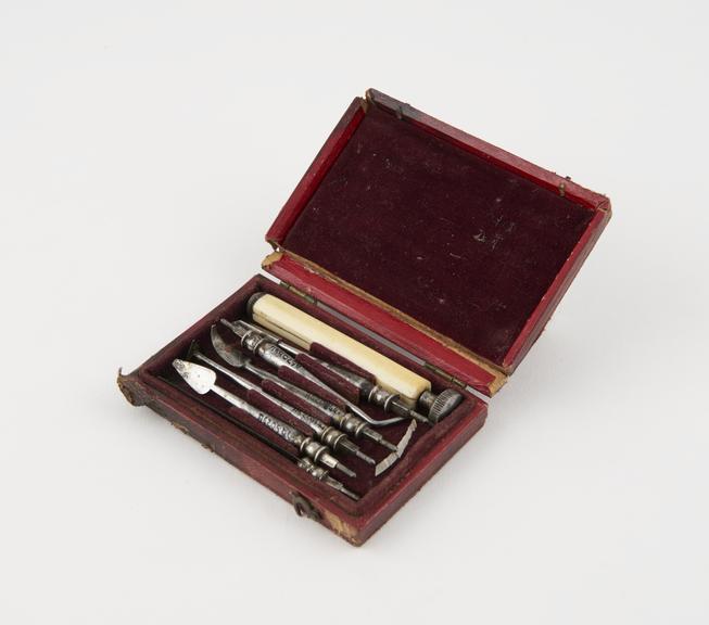 Personal dental descaler set, in red leather covered case