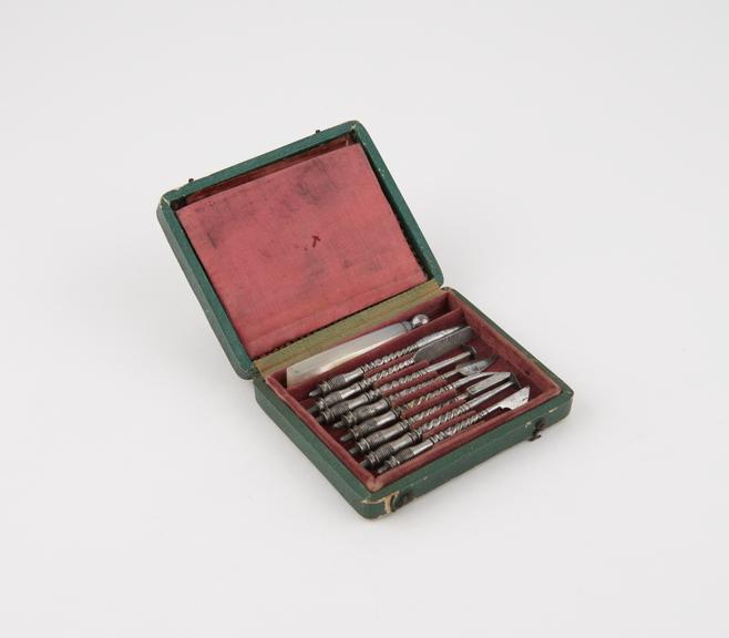 Personal dental descaler set, in green leather covered case