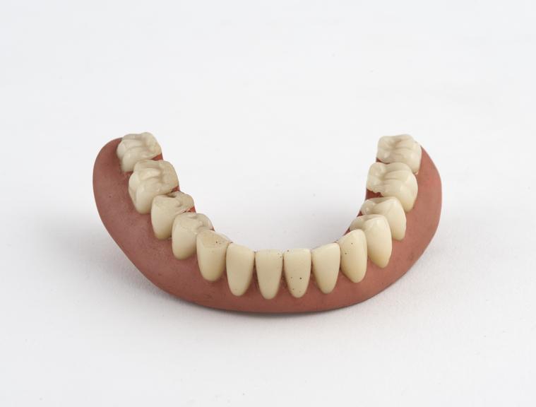 Full lower denture, vulcanite with porcelain teeth, English