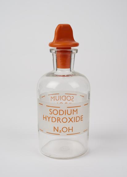 An empty plastic bottle for sodium hydroxide