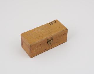 Box containing blade and screws