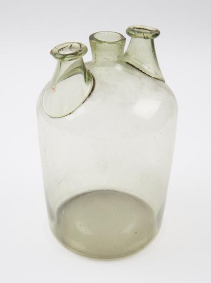 Pale green glass woulfe bottle, cylindrical