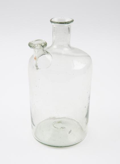 Pale green glass woulfe bottle, cylindrical, pontil on base