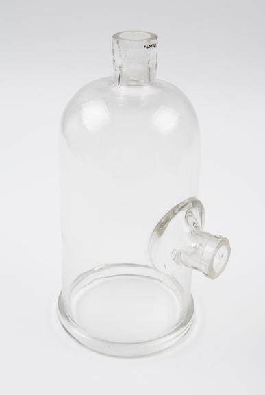 Small clear glass bell jar with outlet at top and side