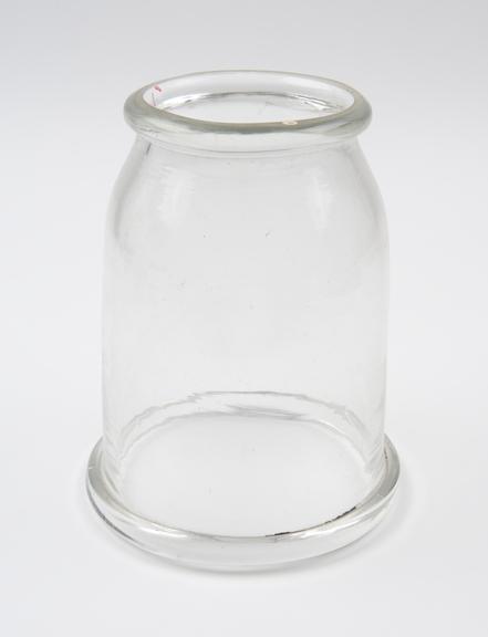 Clear glass bell jar open at either end