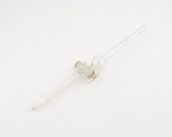 Clear glass burette, with long tap dividing upper and lower