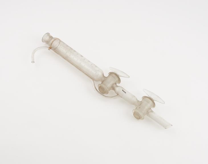 Clear glass burette, calibrated with two taps and curving pipe