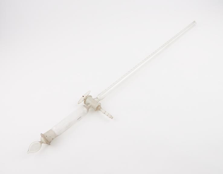 Clear glass burette with graduated body and tap