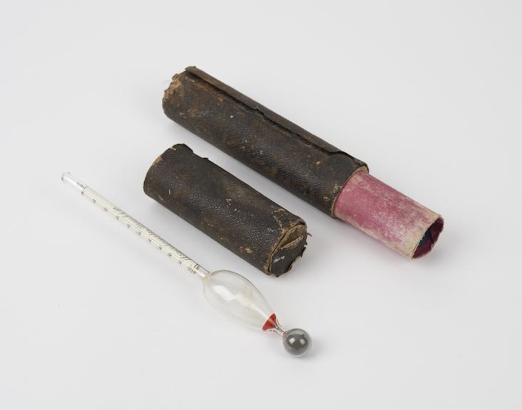 Glass hydrometer with mercury, in cardboard case, by Hughes