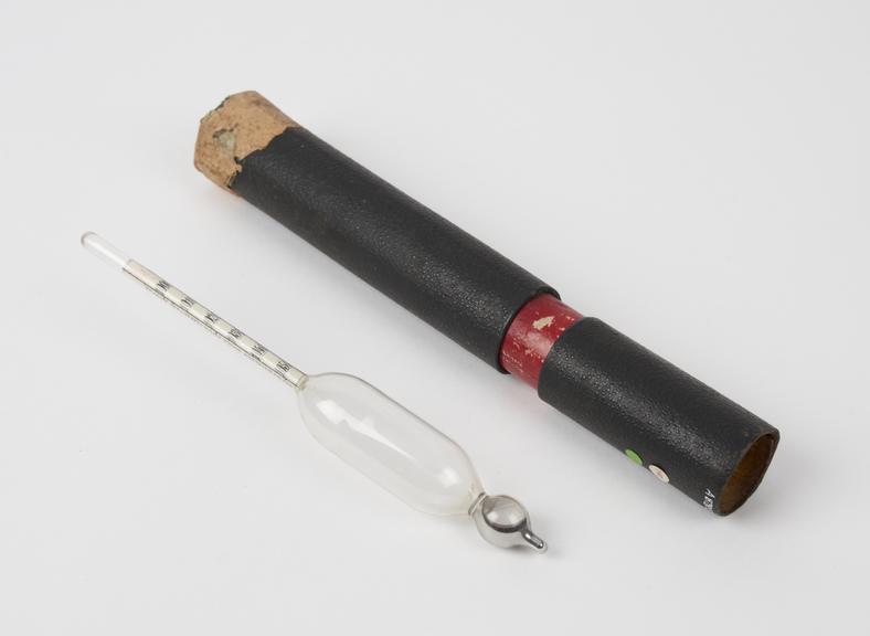 Glass hydrometer in cardboard case, German