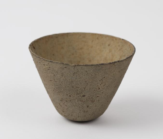 Circular flared earthenware crucible, made with hole in base