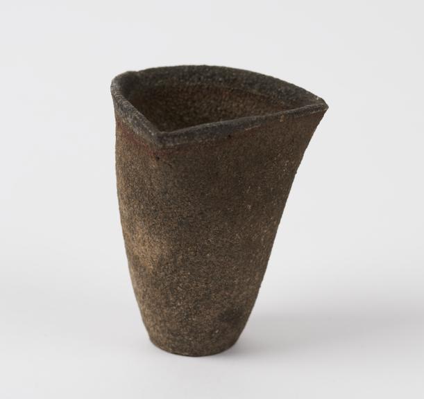 Unglazed earthenware crucible with circular base and triangular