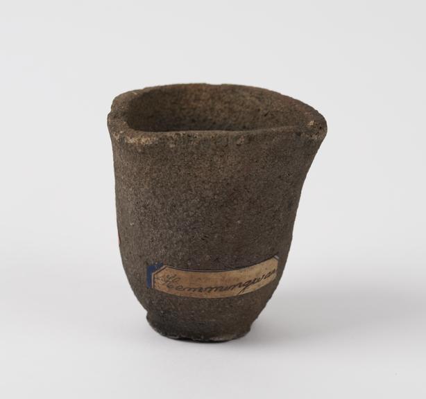 Unglazed earthenware crucible with circular base and triangular