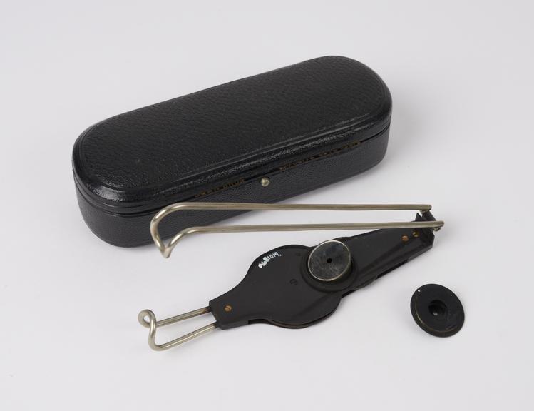 Ophthalmoscope with folding handle, complete in leather case