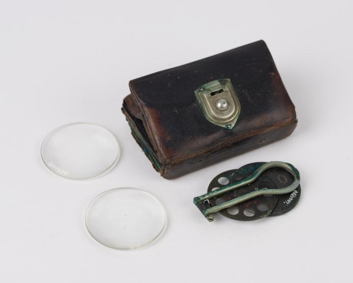 Oldham's' type ophthalmoscope and 2 lenses in folding brown