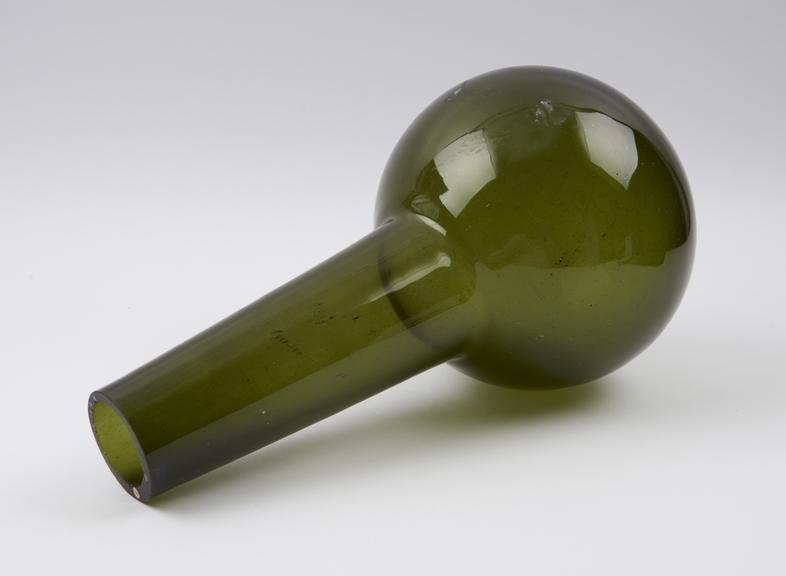 Dark green glass flask, spherical bulb, tubular neck