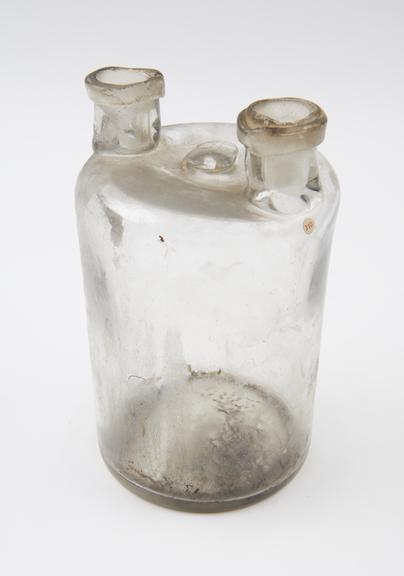 Clear glass woulfe bottle, cylindrical, pontil mark on base