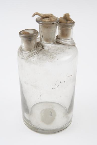 Clear glass woulfe bottle, cylindrical body