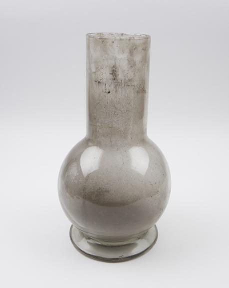 Large clear glass flask with bulbous body and wide cylindrical