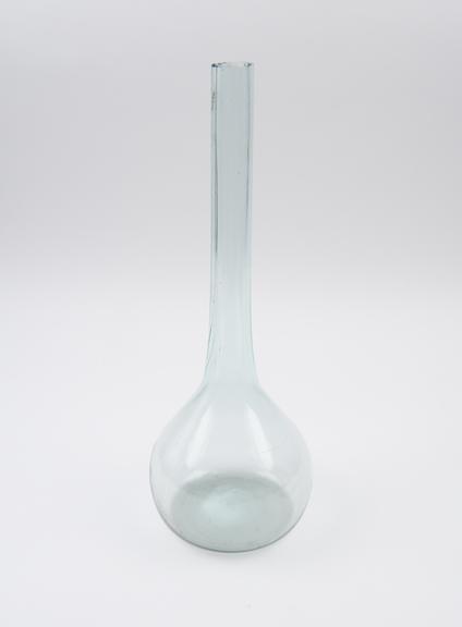 Pale green glass flask, bulbous body, long tubular neck