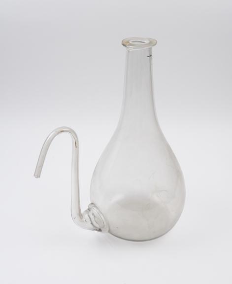 Large clear glass flask, pear shaped, with curving spout