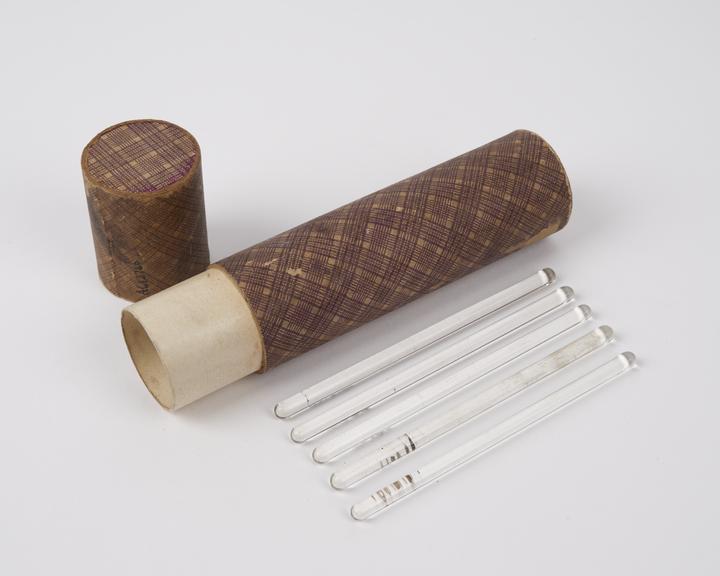 Five glass rods, in cardboard case