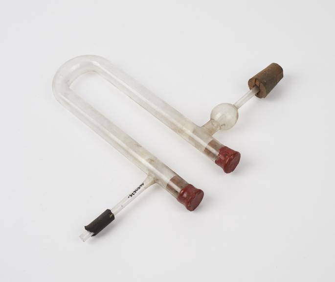 Clear glass u-tube ends of which corked and sealed with wax