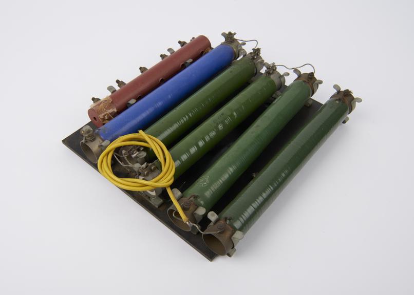 5 resistors mounted of a rectangular bakelite base board