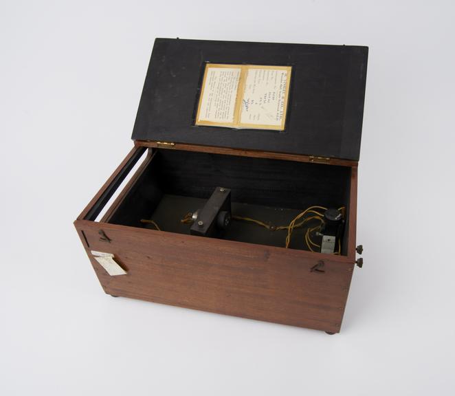 Galvanometer, housed in wooden box, with engraved glass scale