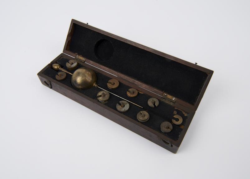 Brass hydrometer in case with weights, 19th century