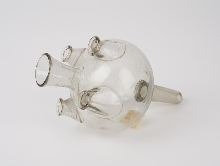 Clear glass vessel, with central mouth and four outlets