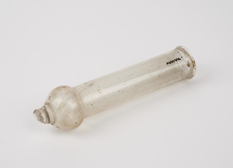 Cylindrical flask with bulbous base and broken rod attachment