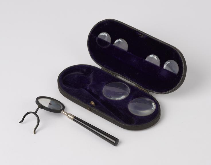 Liebreich's type ophthalmoscope and six lenses in black leather