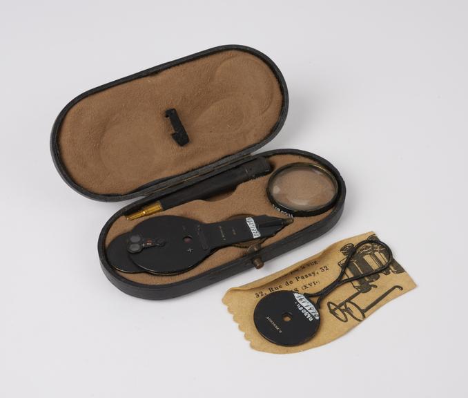 Ophthalmoscope in leather covered case with retinoscope and