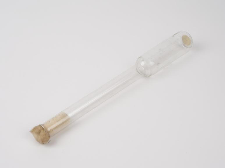 Long, tall thin glass flask, belonged to Professor H