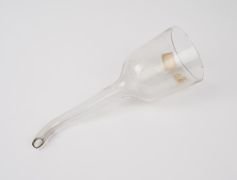 Clear glass funnel with cup shaped neck and curving outlet