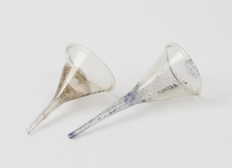 Two small funnels, glass, stained