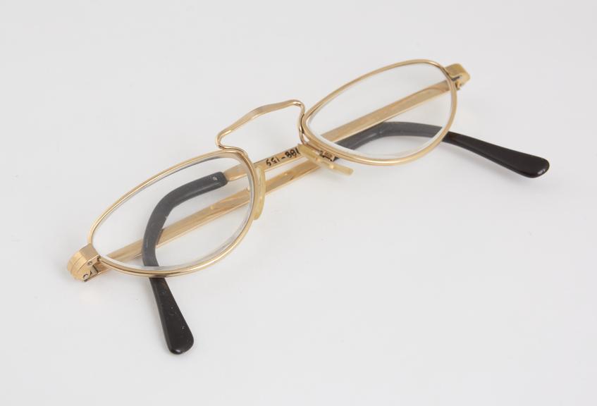 Pair of half moon spectacles with metal frames, made by Cottet