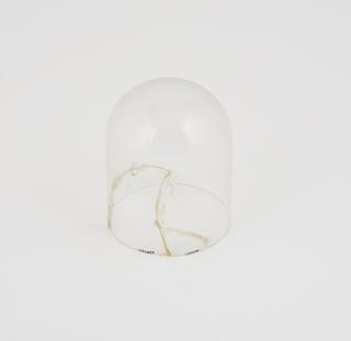 Glass shade with evidence of previous breakage and repair