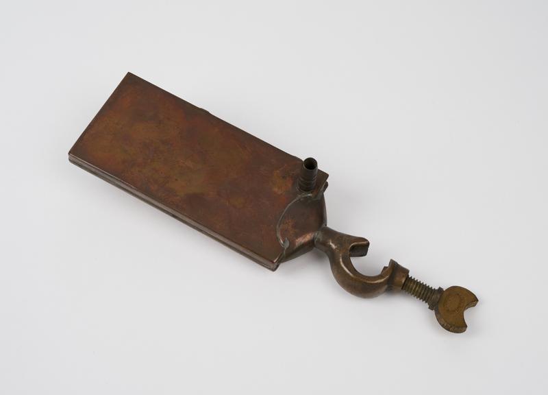 Rectangular warming plate of copper with brass clamp for