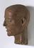 Carved wooden head of a christian martyr, ivory teeth