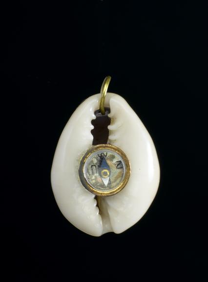 Amulet in the form of a tiny compass