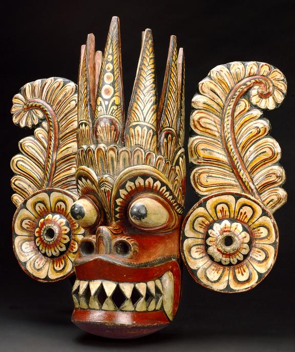 Painted wooden Marurassa mask, with ear pieces