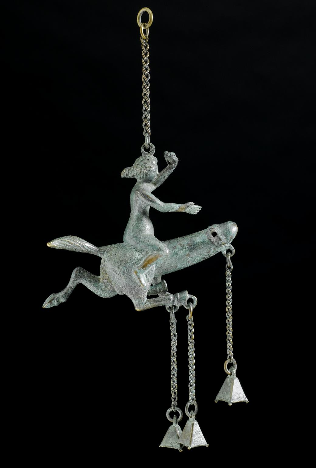 Bronze amulet with horses' hooves and mounted by a woman, Graeco-Roman, 100 BCE-400 CE | Science Museum Group Collection